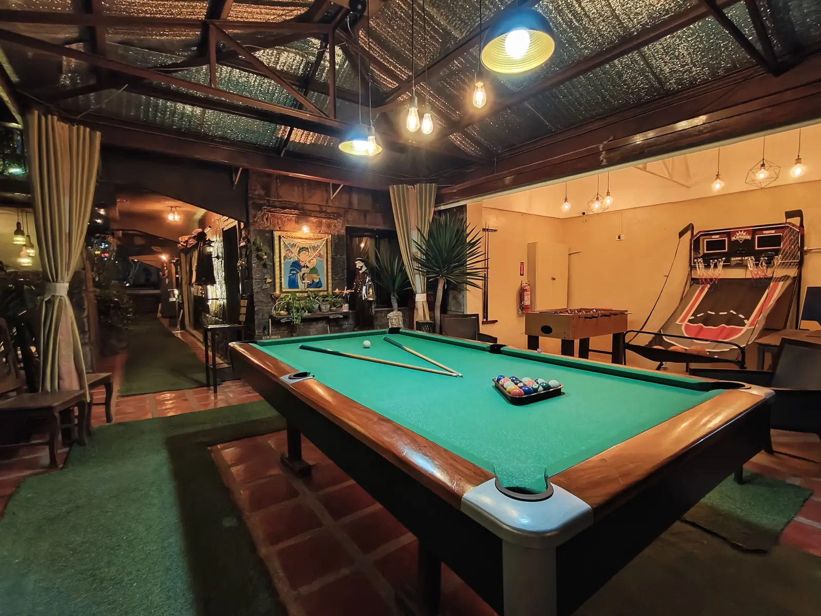 Billiards under hanging lamps