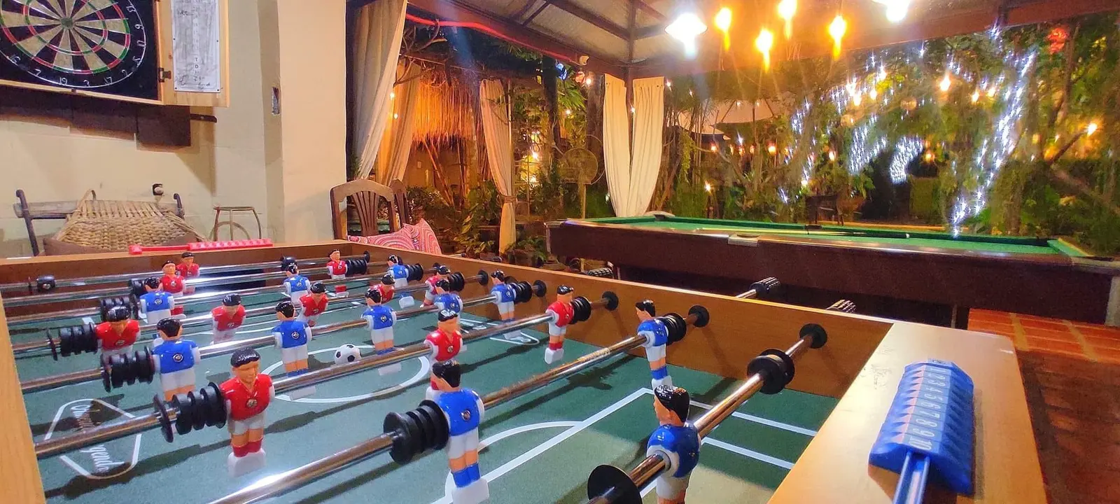 Foosball and darts in the game area