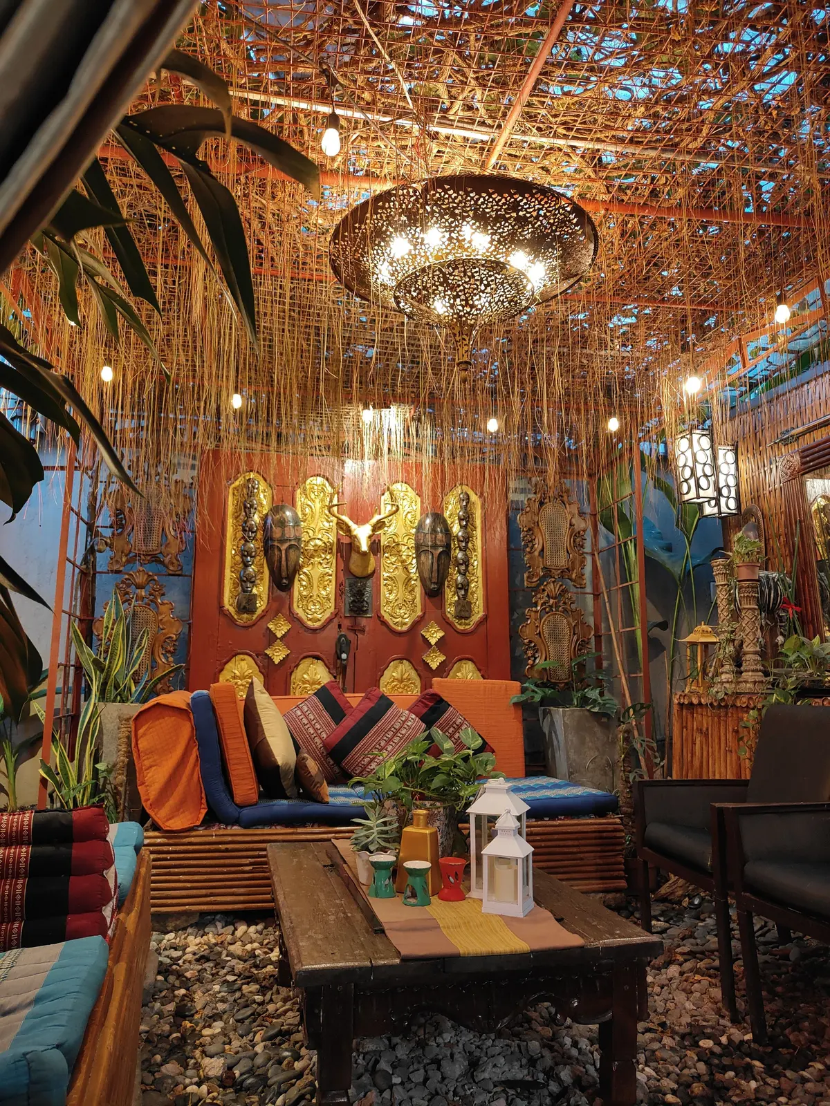 Floor cushions and a low table in the Balinese lounge